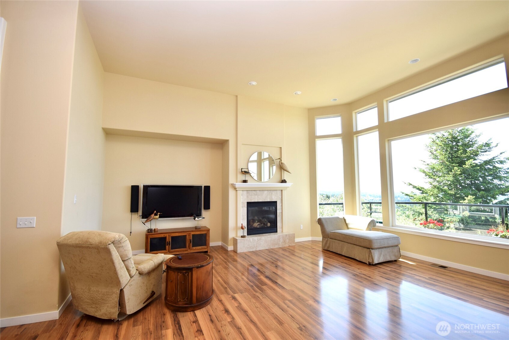 603 Owls Nest Road Sequim, WA 98382 - Photo 7 of 32 a living room with furniture a flat screen tv and a fireplace