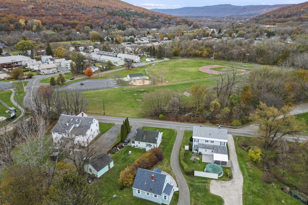 227 Protection North Adams, MA 01247 - Photo 22 of 25 an aerial view of a house with a garden and lake view