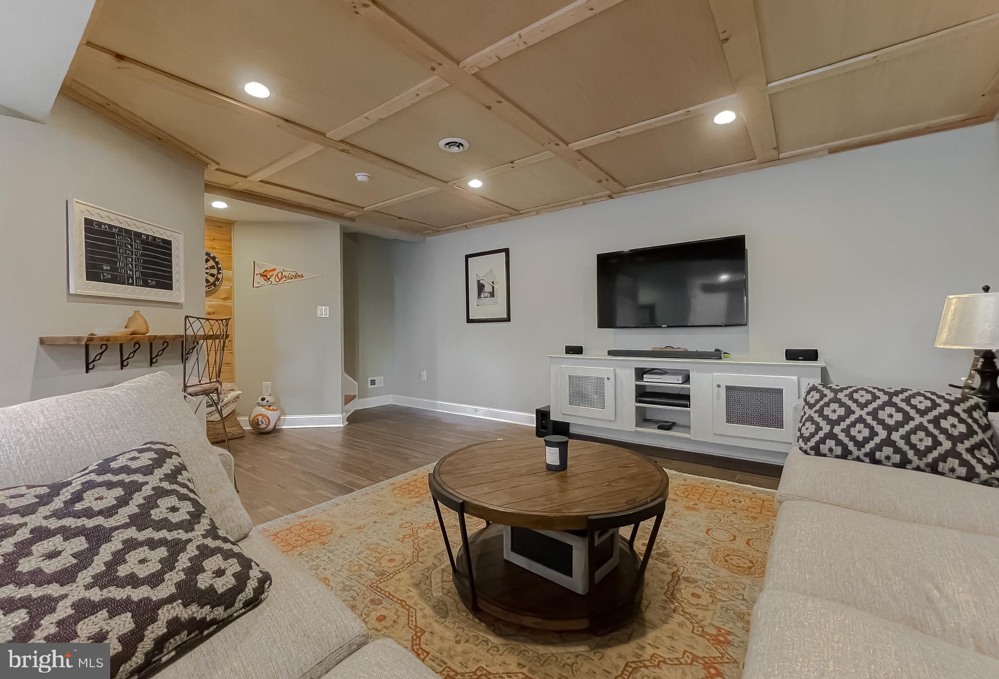 12327 Rashad Circle Lusby, MD 20657 - Photo 54 of 79 a living room with furniture and a flat screen tv