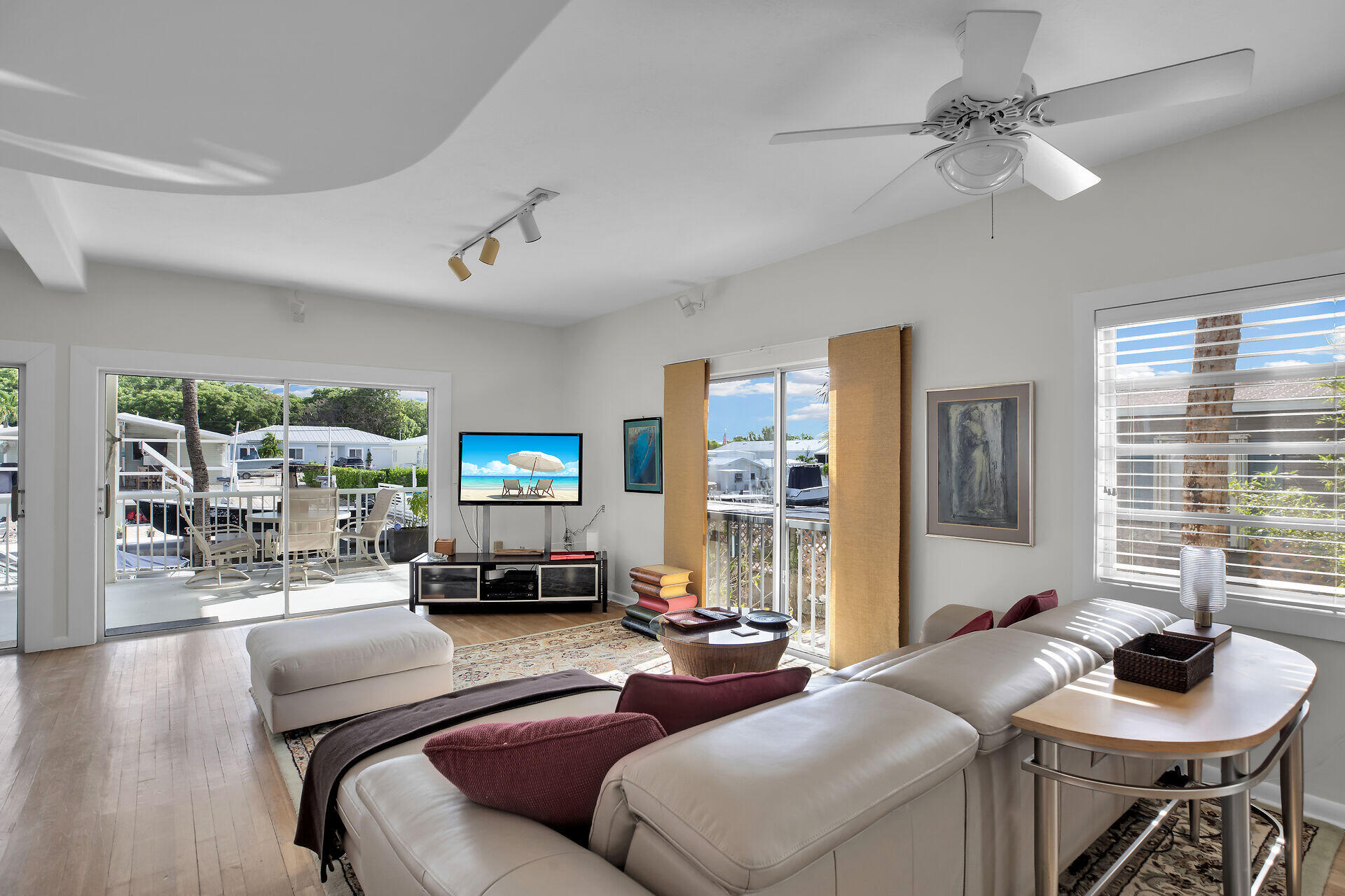 314 Loeb Avenue Key Largo, FL 33037 - Photo 11 of 28 a living room with furniture and a flat screen tv