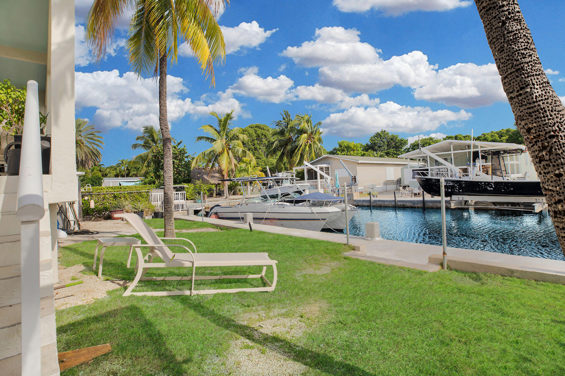 314 Loeb Avenue Key Largo, FL 33037 - Photo 2 of 28 a view of a house with a big yard