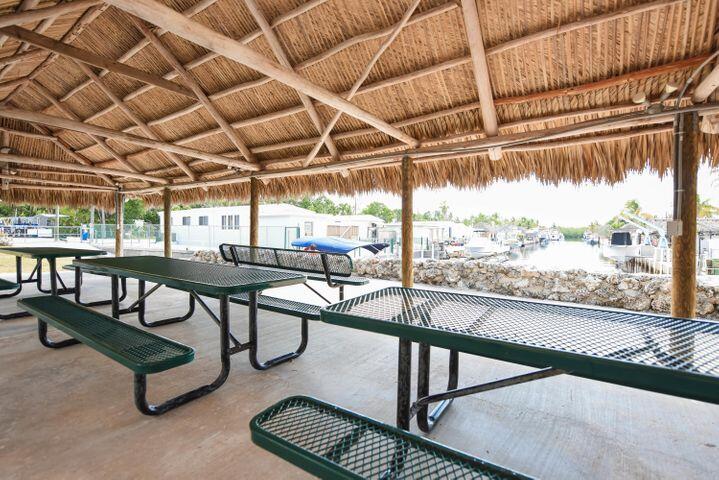 314 Loeb Avenue Key Largo, FL 33037 - Photo 28 of 28 a view of a swimming pool with a lounge chairs