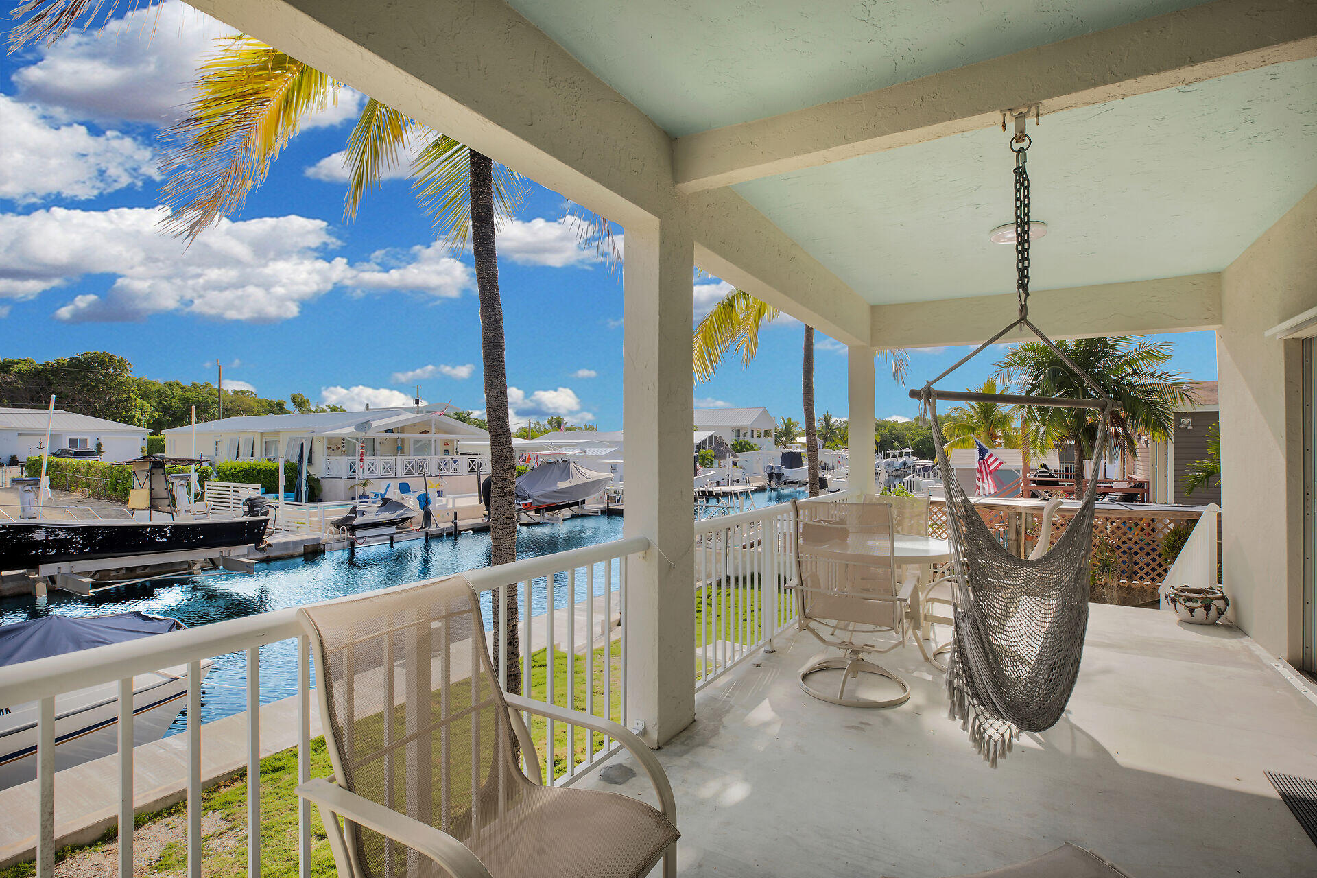 314 Loeb Avenue Key Largo, FL 33037 - Photo 5 of 28 a view of a dining room with furniture fire pit and plants