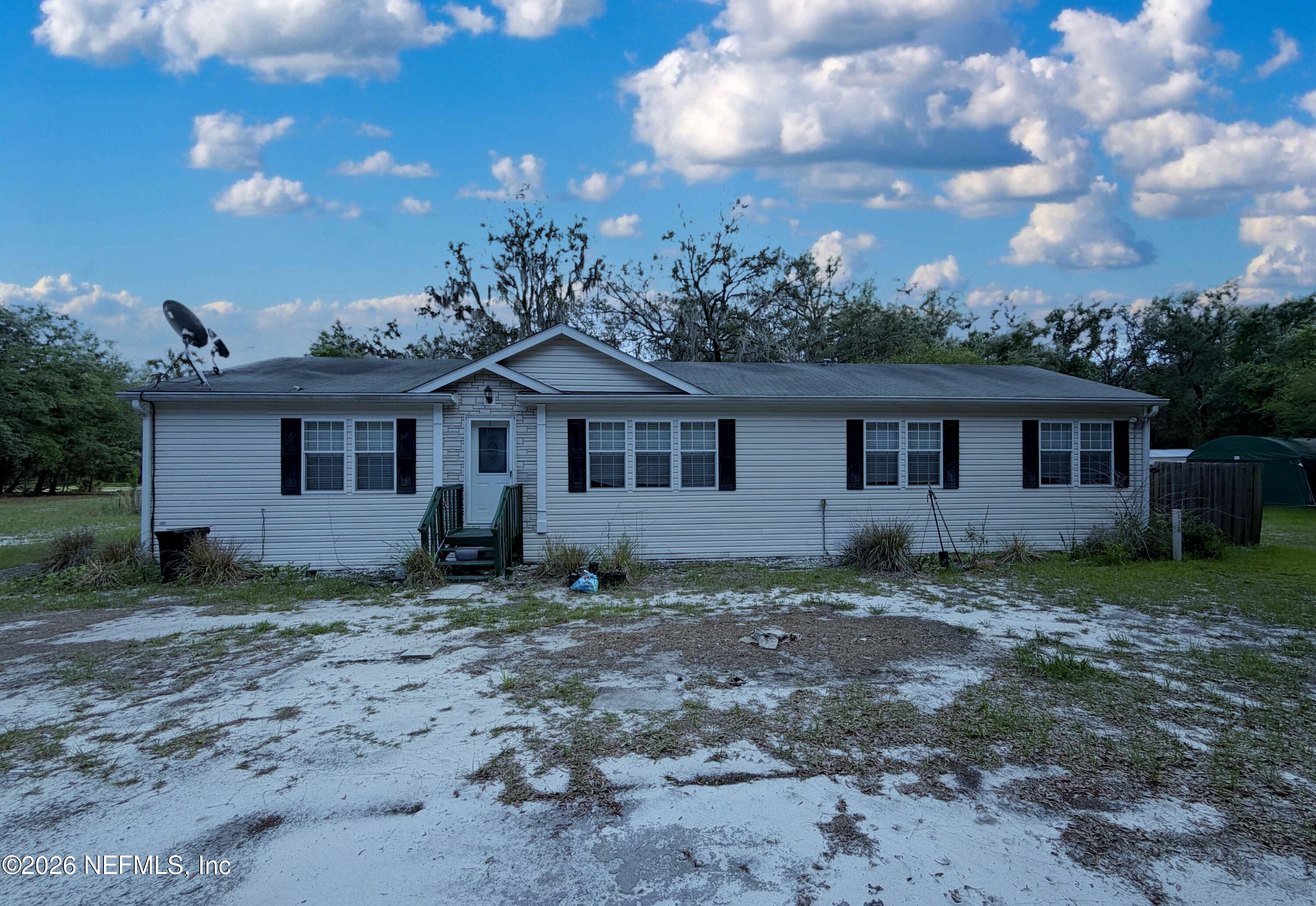 136 Short Pine Road Hawthorne, FL 32640 - Photo 1 of 39 a front view of a house with garden
