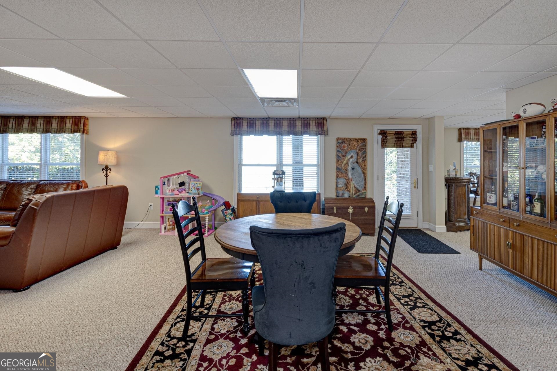 551 Mountain Ridge Drive Manchester, GA 31816 - Photo 42 of 72 Seller uses this space for an eating area. The flooring throughout the basement is a nice high quality carpet.