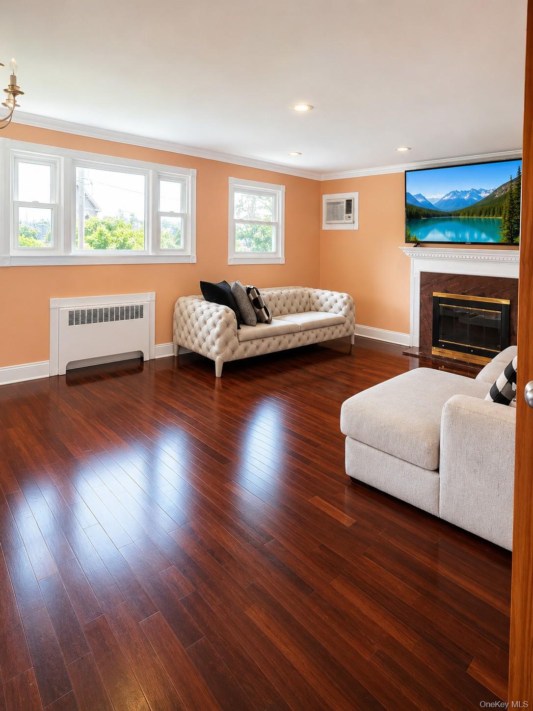 180 Sutton Manor Road New Rochelle, NY 10801 - Photo 5 of 9 a bedroom with furniture and a fireplace