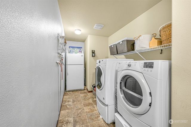 a view of a storage & utility room with washer and dryer