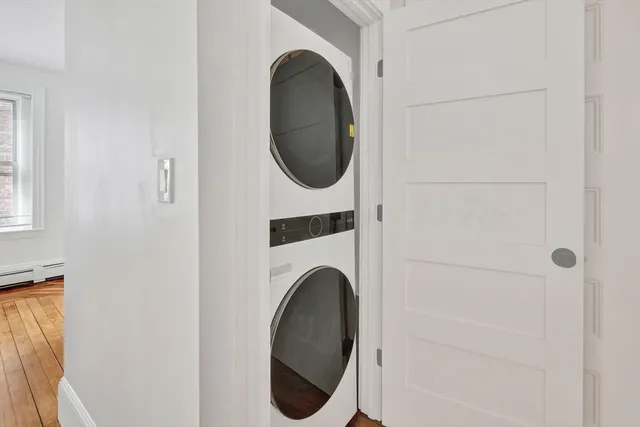 a close view of a utility room with dryer and washer
