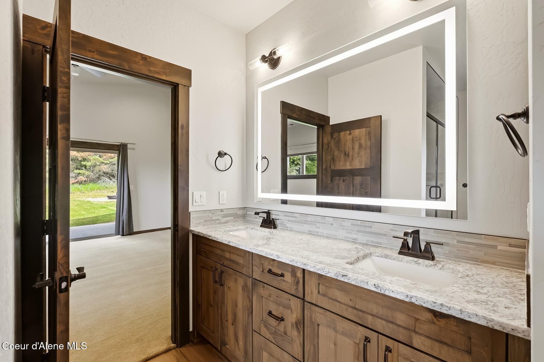 1317 Prominence Court Sandpoint, ID 83864 - Photo 6 of 44 Primary Bedroom En Suite Vanity