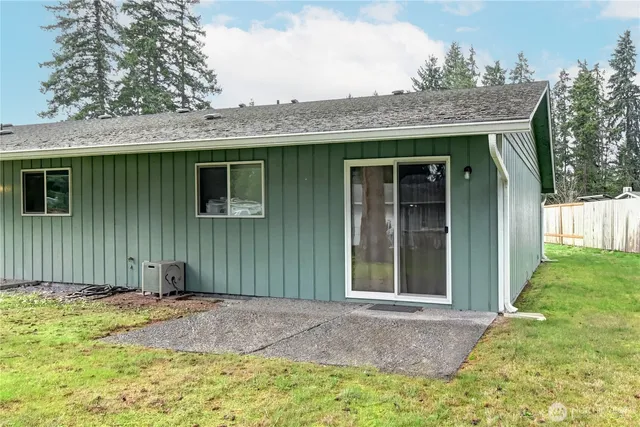 a utility room with dryer washer and a window