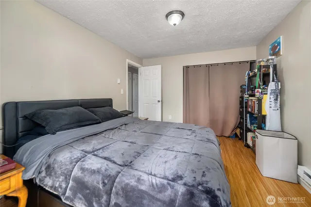 a bed room with a bed and a window