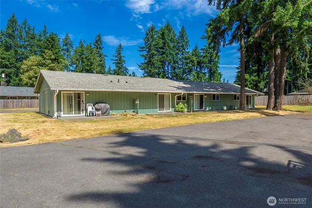 an aerial view of a house with swimming pool
