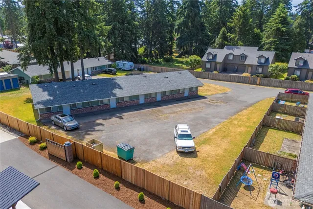 an aerial view of a house with a yard and a garden