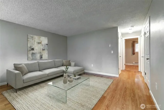 wooden floor in a hall with an empty room