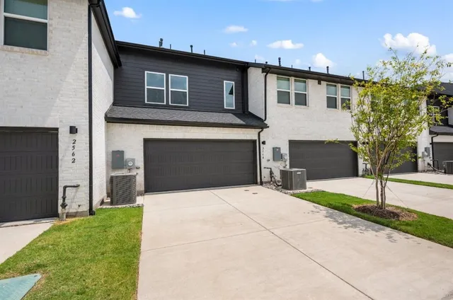 a bathroom with a sink toilet vanity and shower