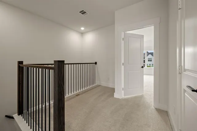 a kitchen with granite countertop white cabinets and stainless steel appliances