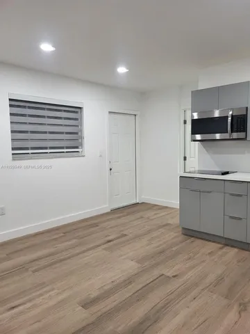 a view of kitchen with wooden floor