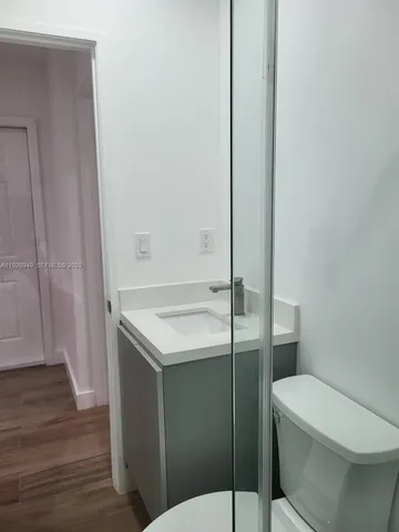 a bathroom with a sink toilet and vanity