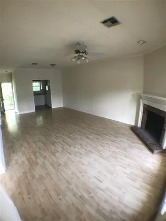 a kitchen with granite countertop a stove a sink and a microwave