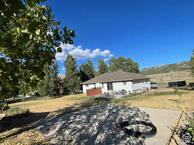 11473 South Dempsey Creek Road Lava Hot Springs, ID 83246 - Photo 35 of 47 View of front of property with a patio and an outdoor fire pit