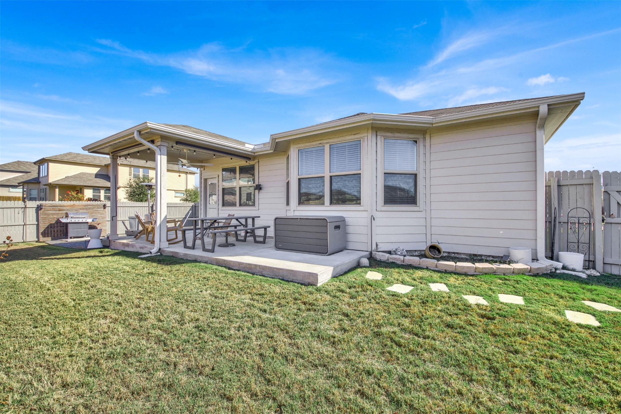 19032 Quebrada Drive Pflugerville, TX 78660 - Photo 27 of 29 Back of property featuring a fenced backyard, a ceiling fan, and a patio