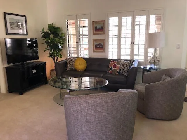 a spacious bathroom with a granite countertop tub sink and mirror