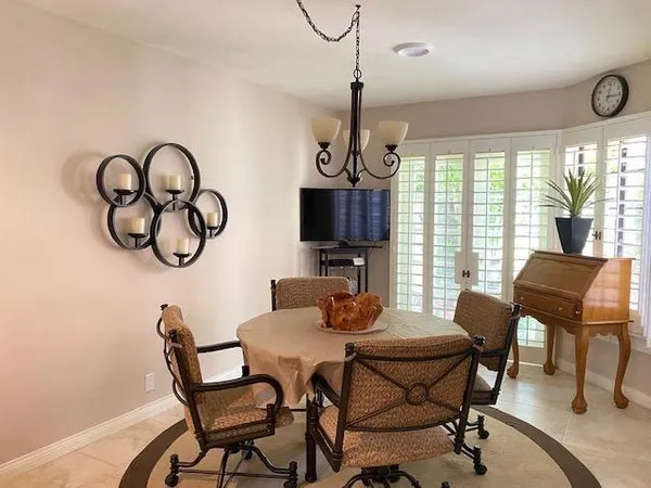 a kitchen with cabinets appliances and a wooden floor