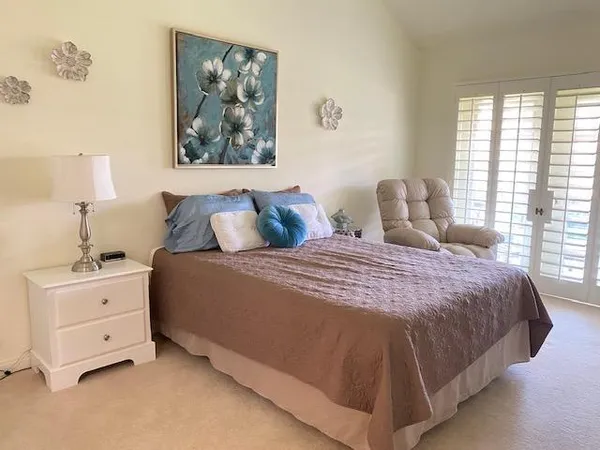 a living room with furniture window and wooden floor