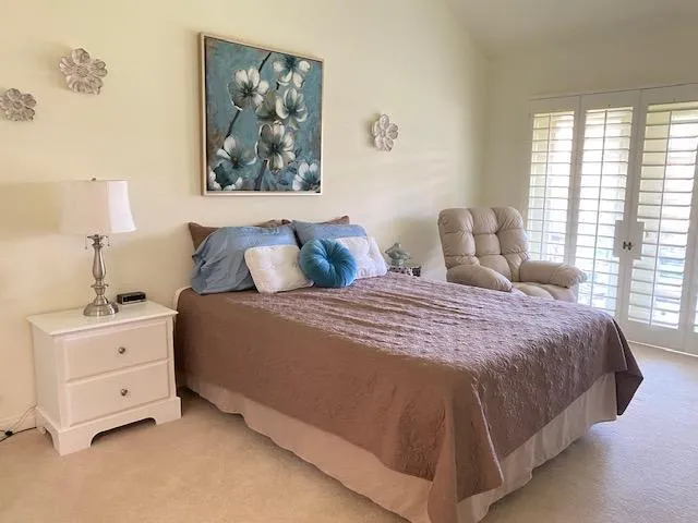 a living room with furniture window and wooden floor