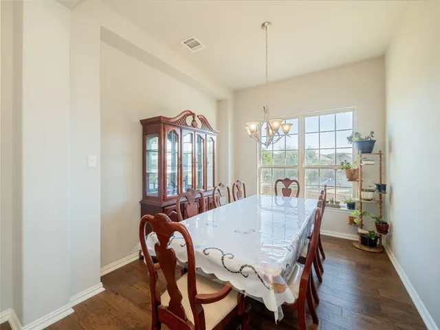 a view of a dining room with furniture and window