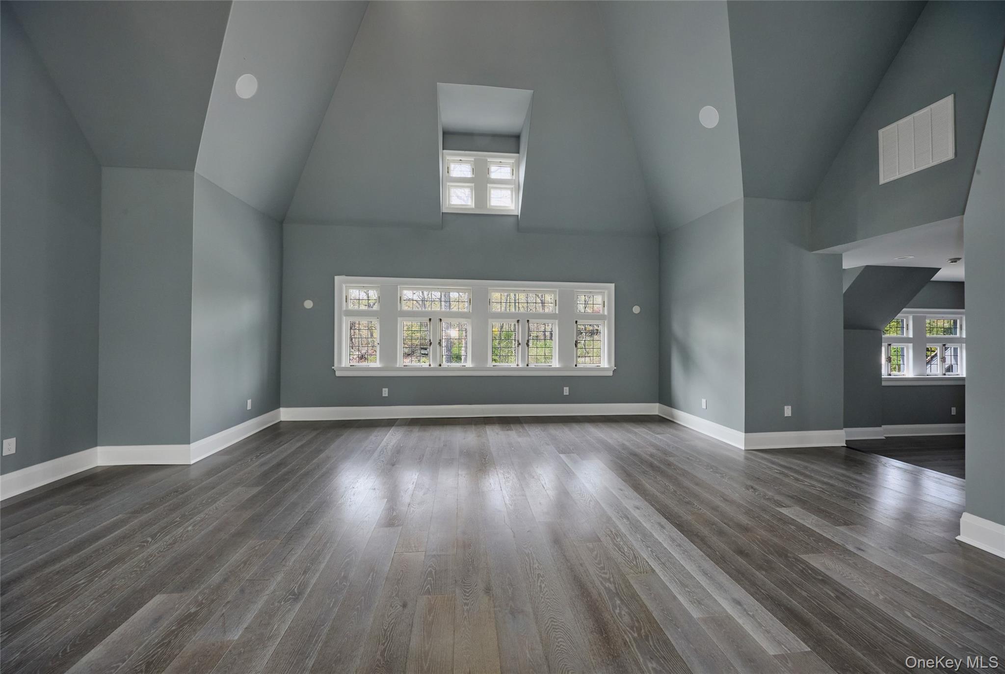 76 Summit Road Tuxedo Park, NY 10987 - Photo 17 of 37 a view of an empty room with wooden floor and a window