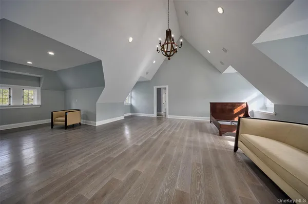 a view of a livingroom with furniture and wooden floor