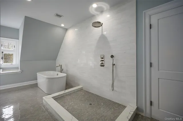 a bathroom with a granite countertop sink a toilet and shower