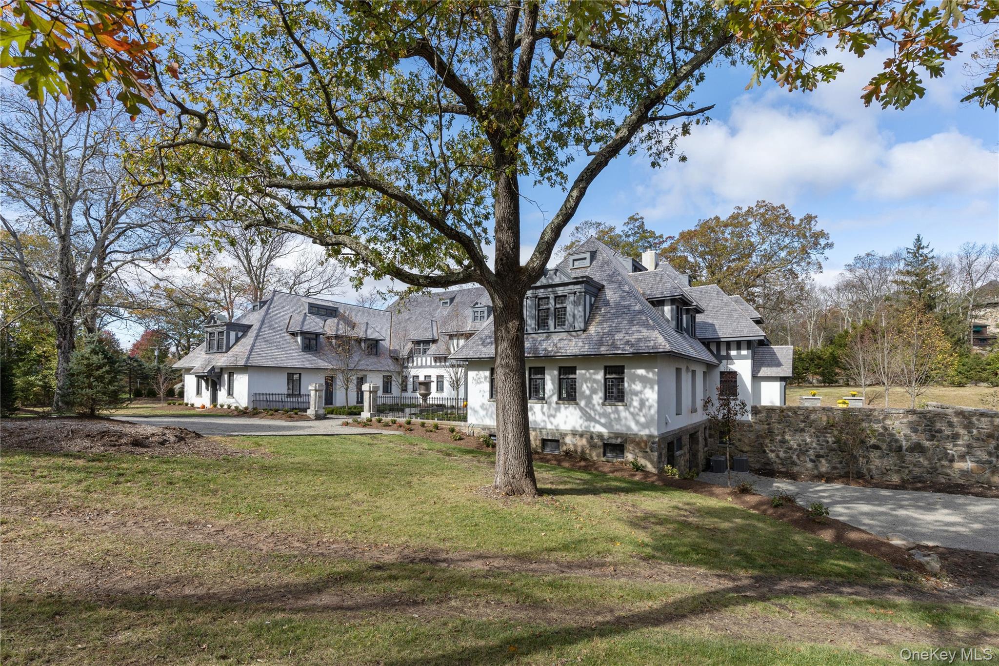76 Summit Road Tuxedo Park, NY 10987 - Photo 3 of 37 a view of a town with large trees
