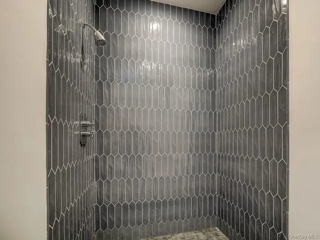 a spacious bedroom with a bed and a window