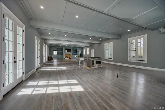 a lobby with furniture and floor to ceiling window