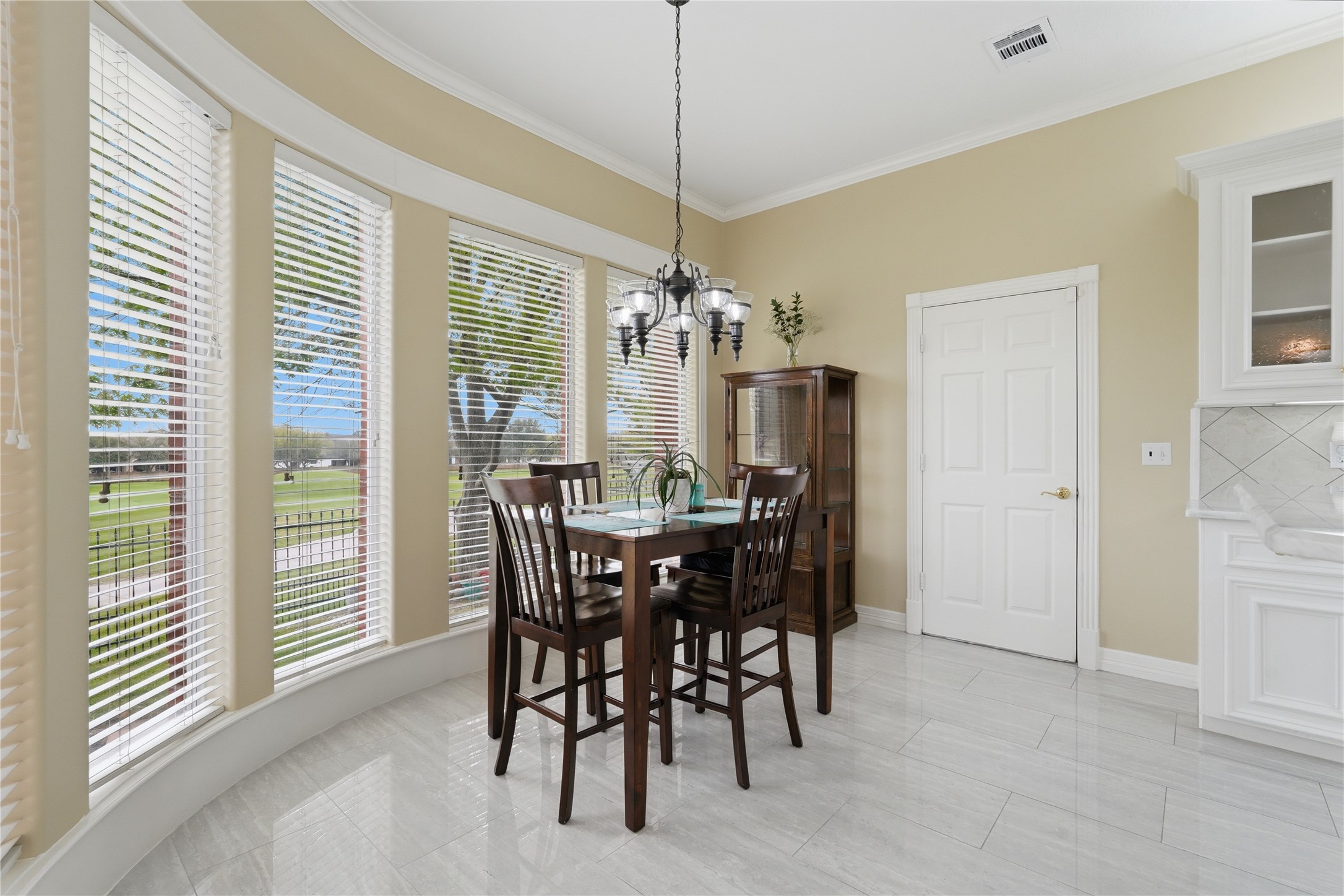 55 Monterrey Road East Montgomery, TX 77356 - Photo 21 of 50 This bright dining area features large bay windows with blinds, allowing natural light to fill the space.