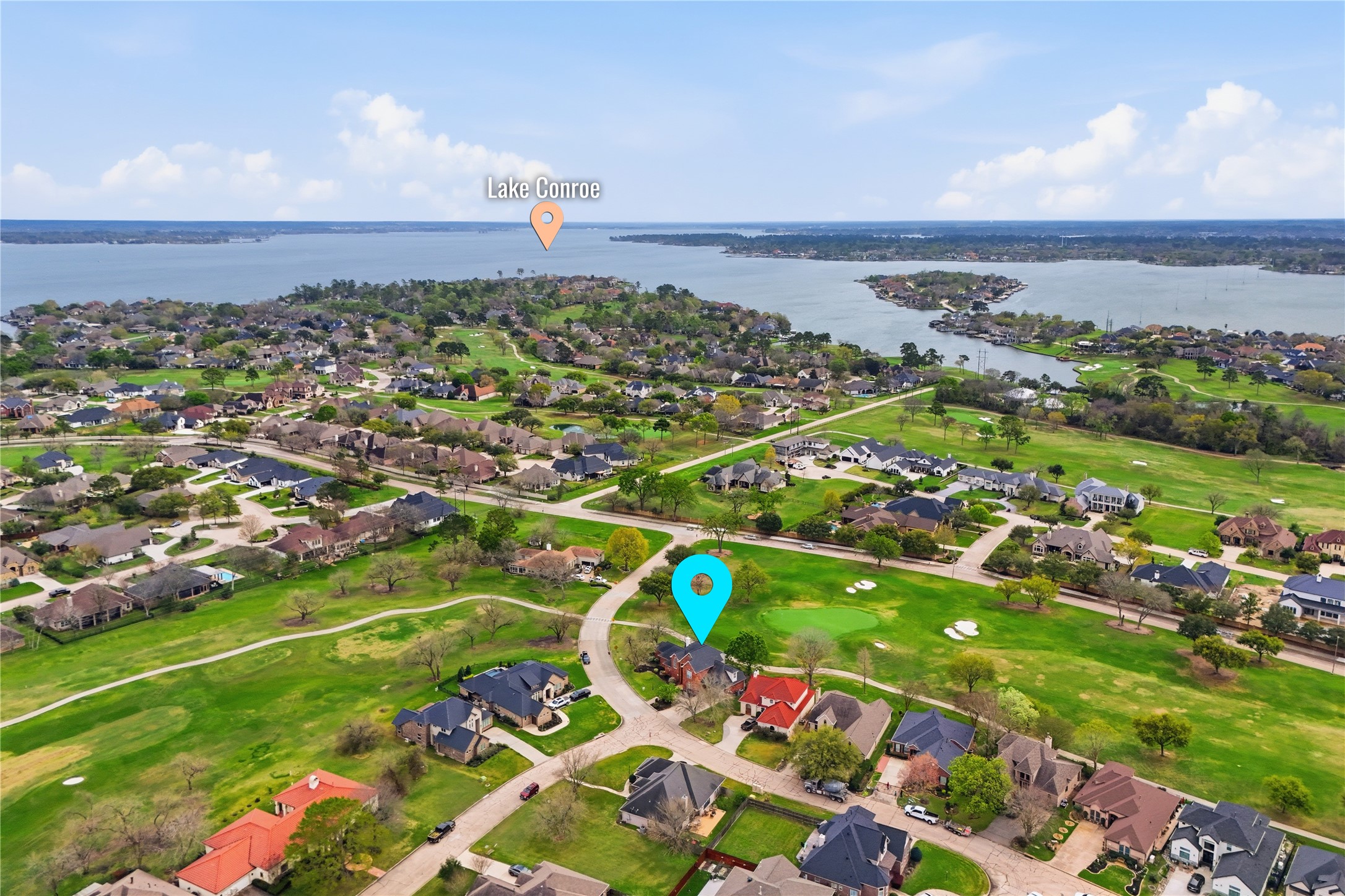 55 Monterrey Road East Montgomery, TX 77356 - Photo 47 of 50 This aerial photo showcases a residential neighborhood near Lake Conroe. The area features spacious homes surrounded by green lawns and trees, with proximity to the lake offering scenic views and recreational opportunities.