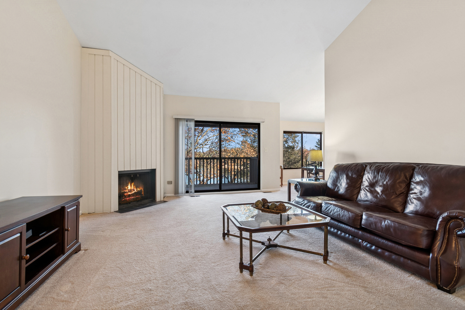 33 Shoreline Road, Unit B Lake Barrington, IL 60010 - Photo 19 of 49 a living room with furniture and a fireplace