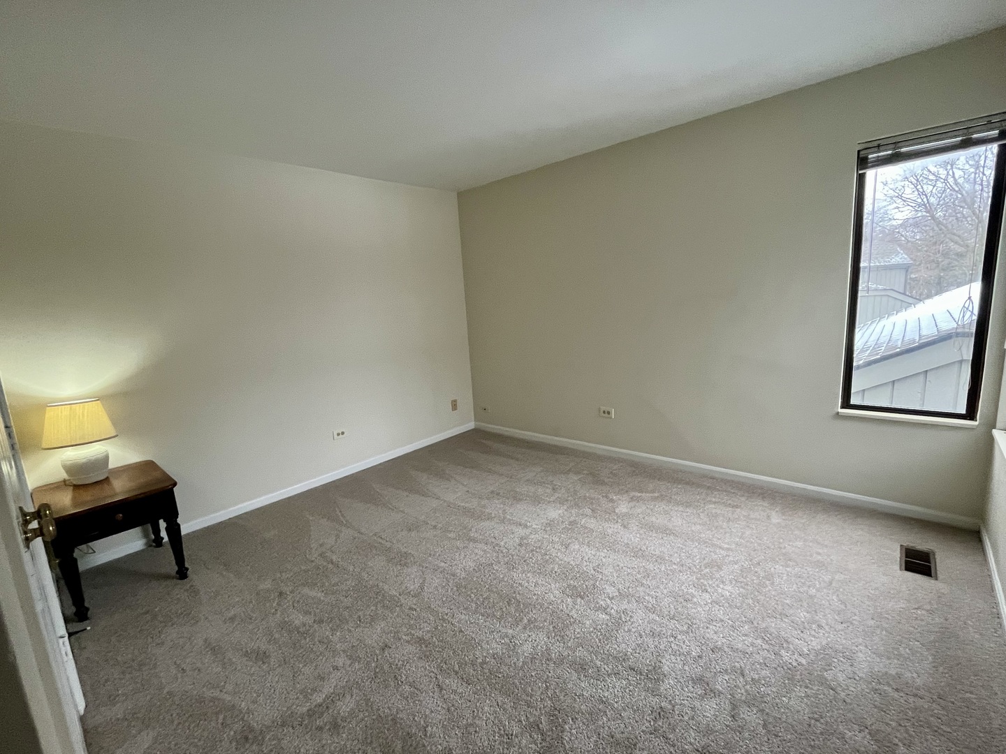 33 Shoreline Road, Unit B Lake Barrington, IL 60010 - Photo 26 of 49 a view of room with window and a chair