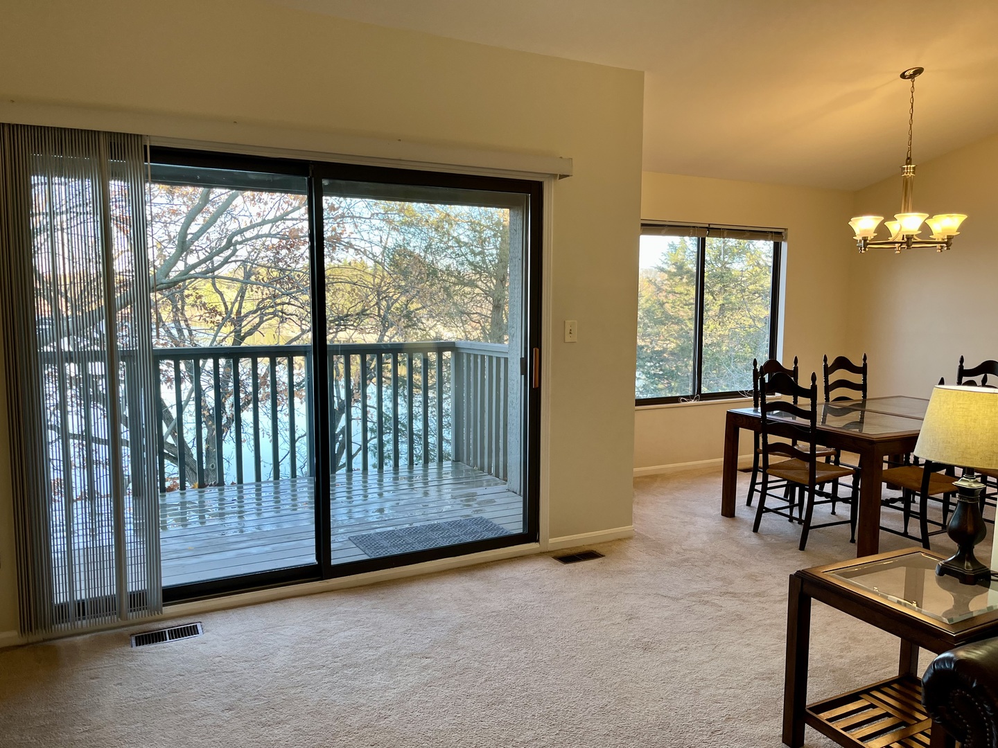 33 Shoreline Road, Unit B Lake Barrington, IL 60010 - Photo 3 of 49 a view of a dining room with furniture window and outside view