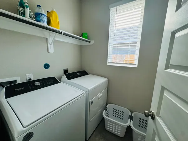 a bathroom with a sink a toilet and shower curtain