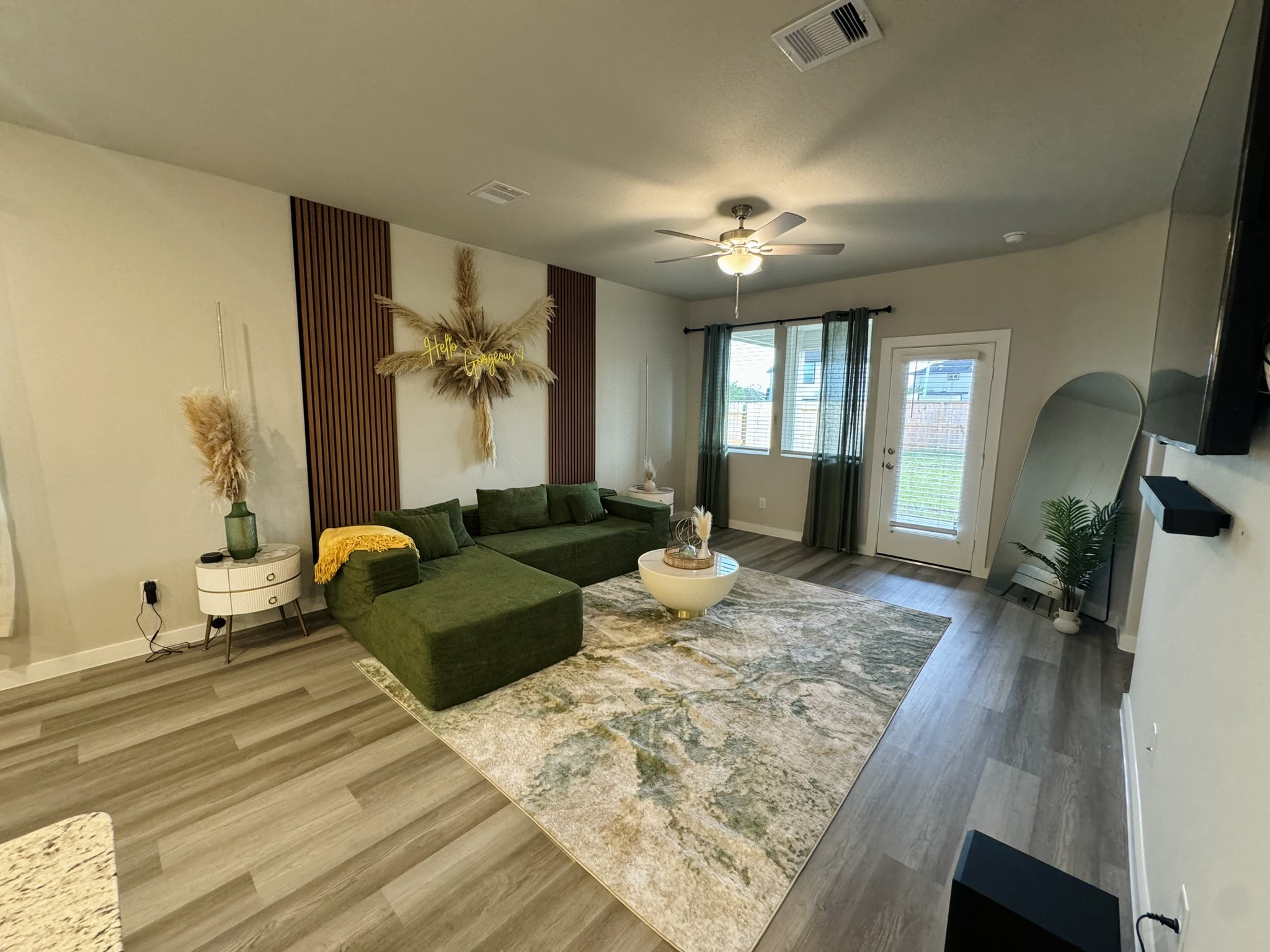 5608 Madden Lane Houston, TX 77048 - Photo 29 of 29 a living room with furniture and a chandelier