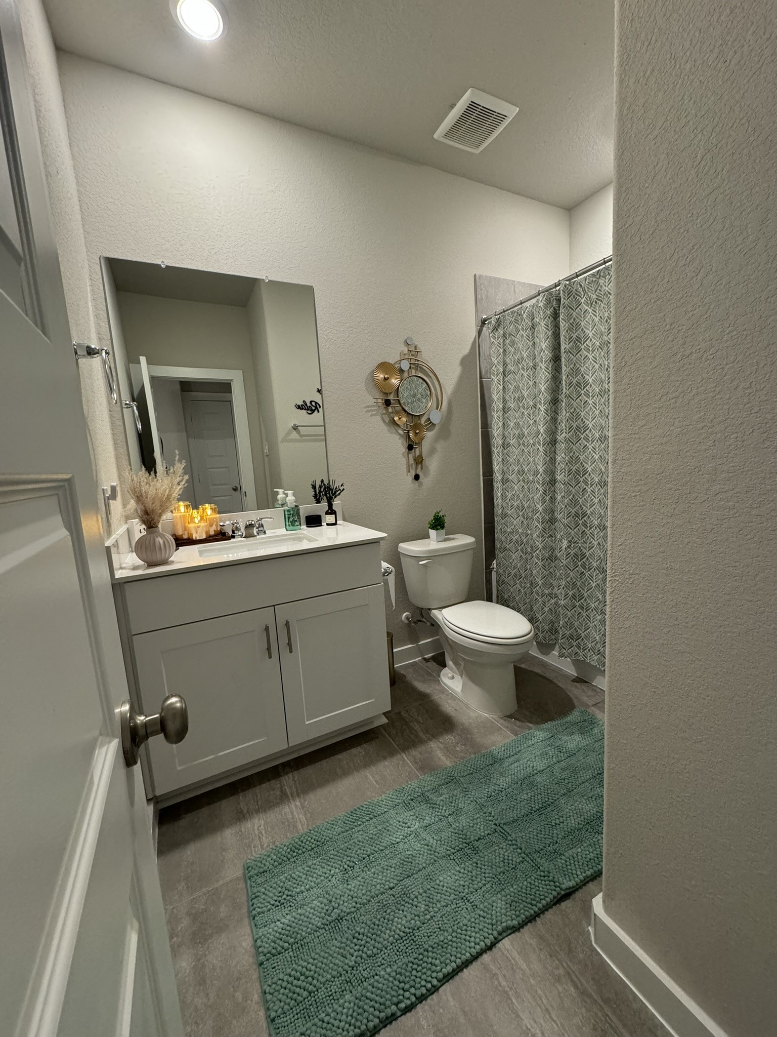 5608 Madden Lane Houston, TX 77048 - Photo 25 of 29 a bathroom with a toilet sink and mirror