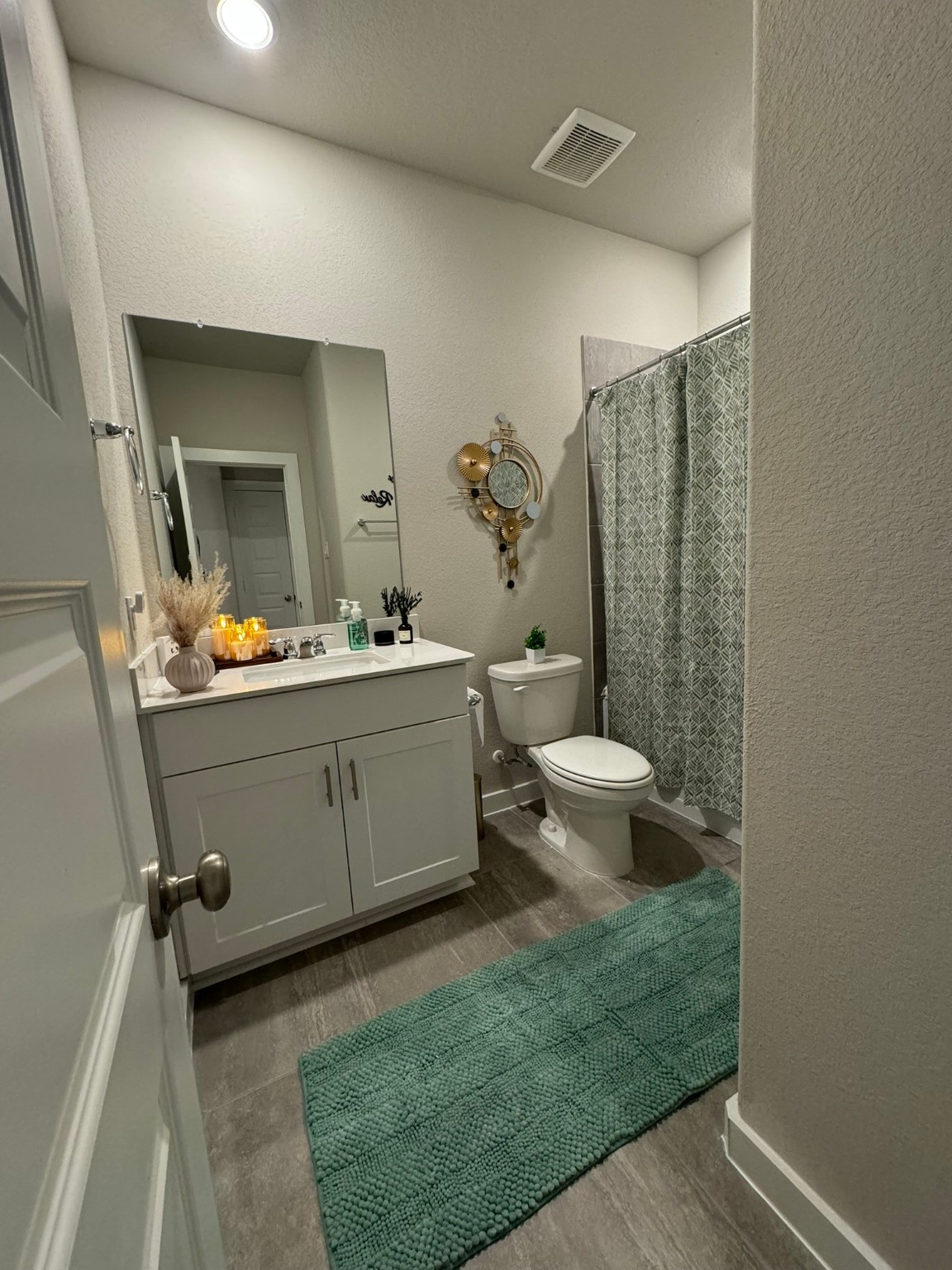 5608 Madden Lane Houston, TX 77048 - Photo 25 of 29 a bathroom with a toilet sink and mirror