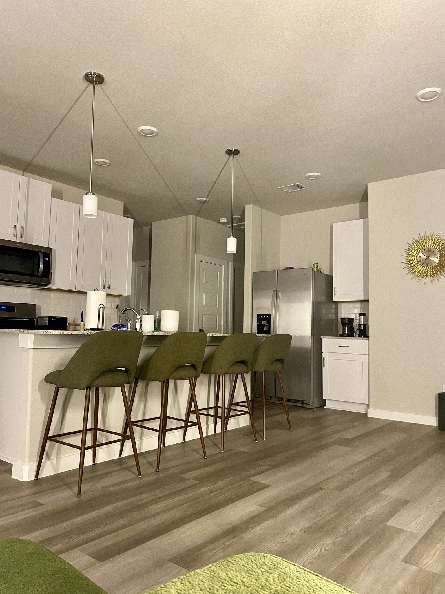 5608 Madden Lane Houston, TX 77048 - Photo 6 of 29 a kitchen with stainless steel appliances kitchen island granite countertop a table chairs and a refrigerator