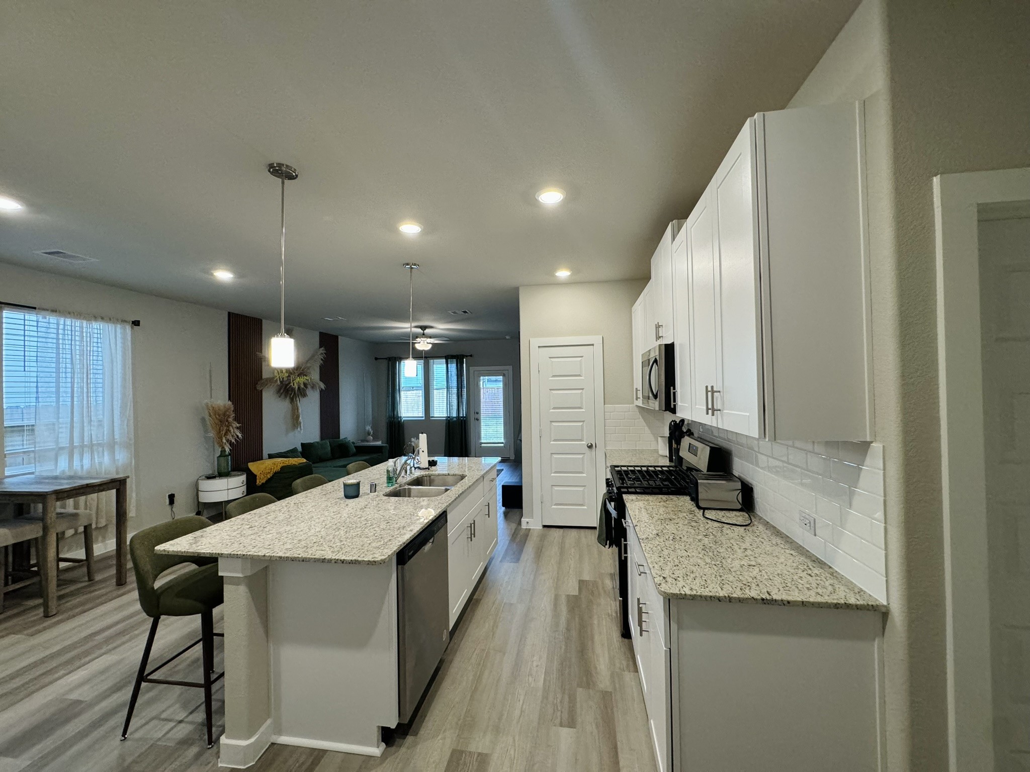 5608 Madden Lane Houston, TX 77048 - Photo 7 of 29 a large kitchen with a counter top space a sink stainless steel appliances and cabinets