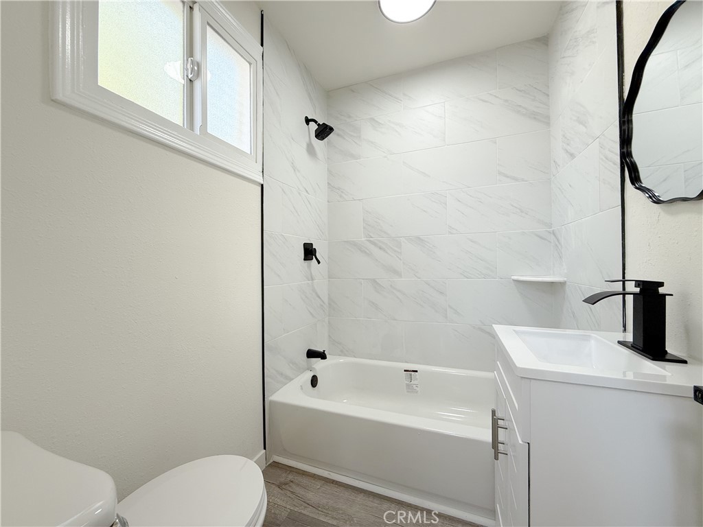 521 West Cherry Street Compton, CA 90222 - Photo 11 of 20 a bathroom with a sink a toilet and shower