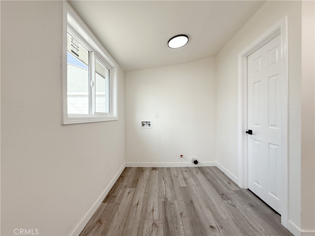 521 West Cherry Street Compton, CA 90222 - Photo 19 of 20 a view of a room with wooden floor and windows