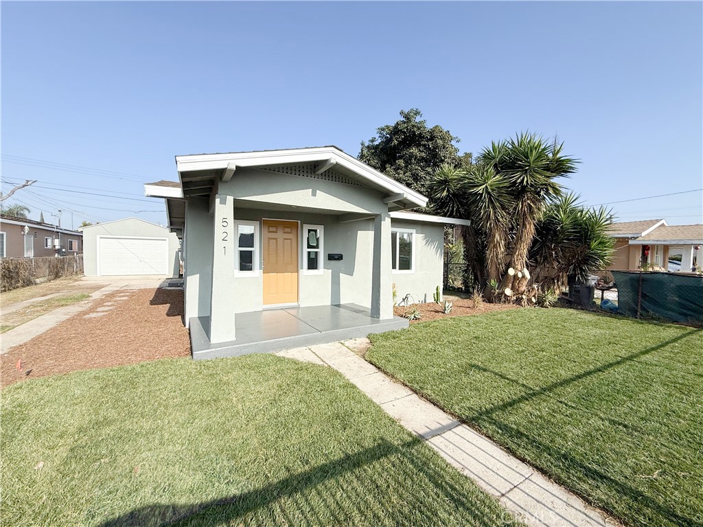 521 West Cherry Street Compton, CA 90222 - Photo 2 of 20 a front view of a house with a yard